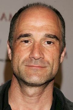 Elias Koteas interpreta Alvin Olinsky