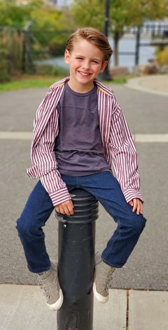 Gavin Maddox Bergman interpreta Boy in Stroller (uncredited)