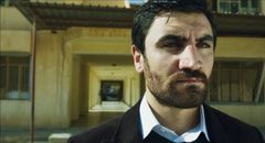 Korkmaz Arslan interpreta Kurdish Colonel