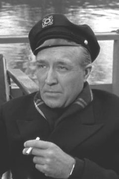 Grandon Rhodes interpreta Rev. MacCurdy (uncredited)