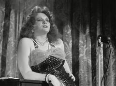 June Smaney interpreta Club Patron (uncredited)