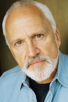 John Rubinstein interpreta Stan Minsky