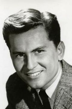 Billy Gray interpreta Sig Poliakoff
