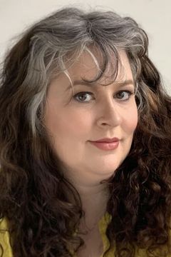Suzanne Smith interpreta Roland's Assistant