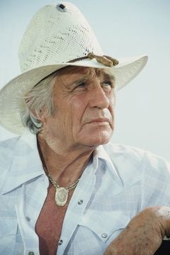 Jim Davis interpreta Jock Ewing