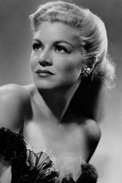 Claire Trevor interpreta May Holst