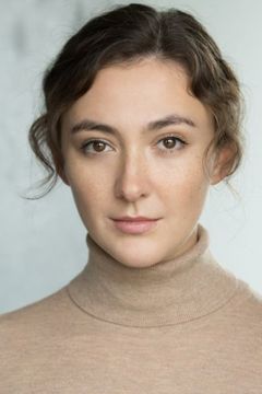 Natalie Lauren interpreta Parisian Woman (uncredited)