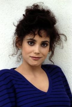 Stacey Nelkin interpreta Ellie Grimbridge
