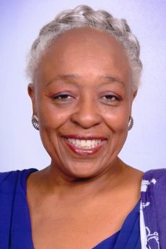 Louisa Abernathy interpreta Bank Teller