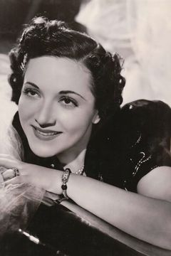 June Clayworth interpreta Mrs. May Elkwood