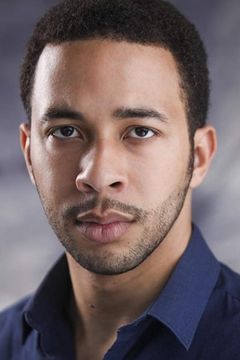 Greg Lockett interpreta Gotham Reporter