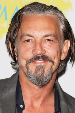 Tommy Flanagan interpreta Irish Henchman