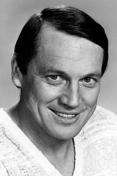 Sonny Shroyer interpreta Enos Strate