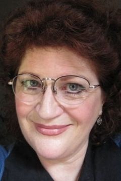 Barbara Tirrell interpreta Olga
