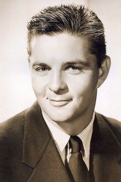 John Mitchum interpreta Elmer - Jason's Bartender