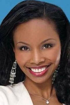 Cynne Simpson interpreta Newscaster 1