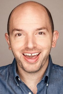 Paul Scheer interpreta Wembley News Anchor #2