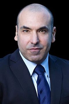 Rick Hoffman interpreta Louis Litt