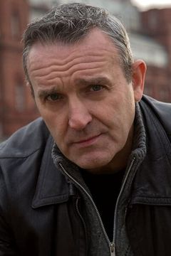Mark Moraghan interpreta Jodge Monroe (uncredited)