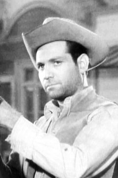 John Goddard interpreta Cowboy (uncredited)