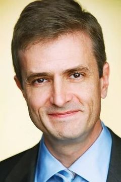 Dan Sachoff interpreta Florida TV Reporter
