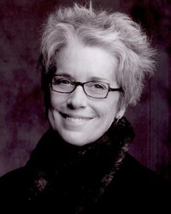 Kate Lynch interpreta Nessle Carroway