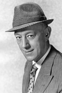 Alec Guinness interpreta Henry'Dutch' Holland